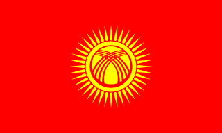 The flag of Kyrgyzstan features a yellow sun with forty rays at the center of a red field. At the center of the sun is a stylized depiction of a tunduk.