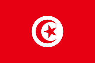 The flag of Tunisia has a red field. A white circle bearing a five-pointed red star within a fly-side facing red crescent is situated at the center of the field.